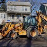 Case backhoe loader on a utility job