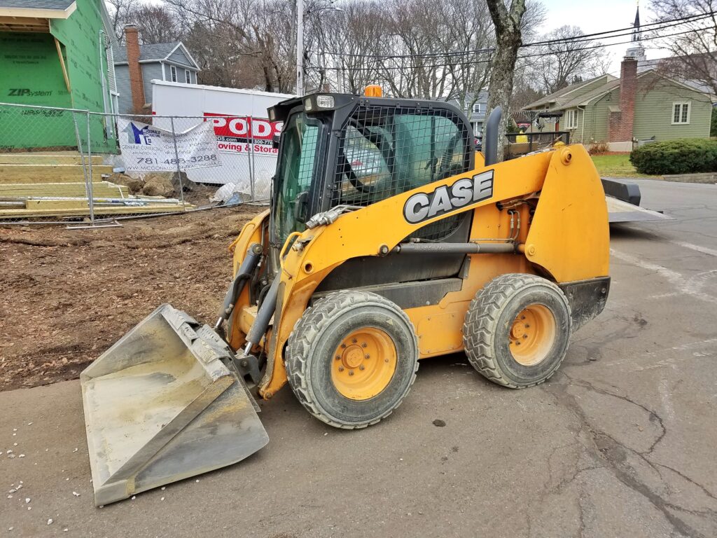 Case skid steer loader with smooth bucket