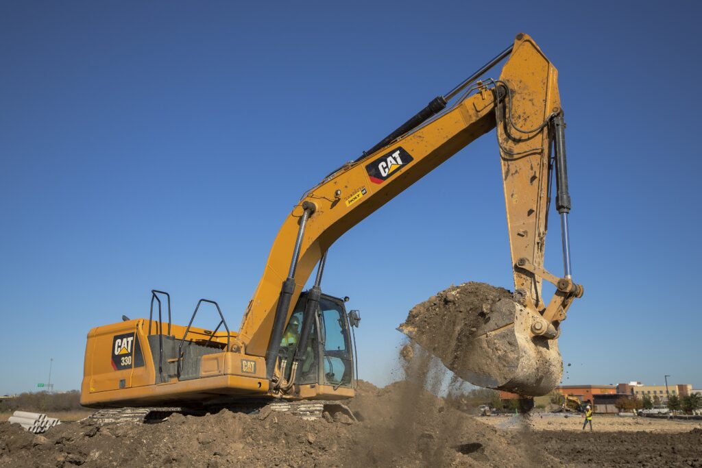 Caterpillar 330 crawler excavator digging on a site
