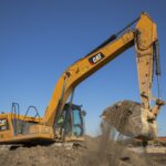 Caterpillar 330 crawler excavator digging on a site