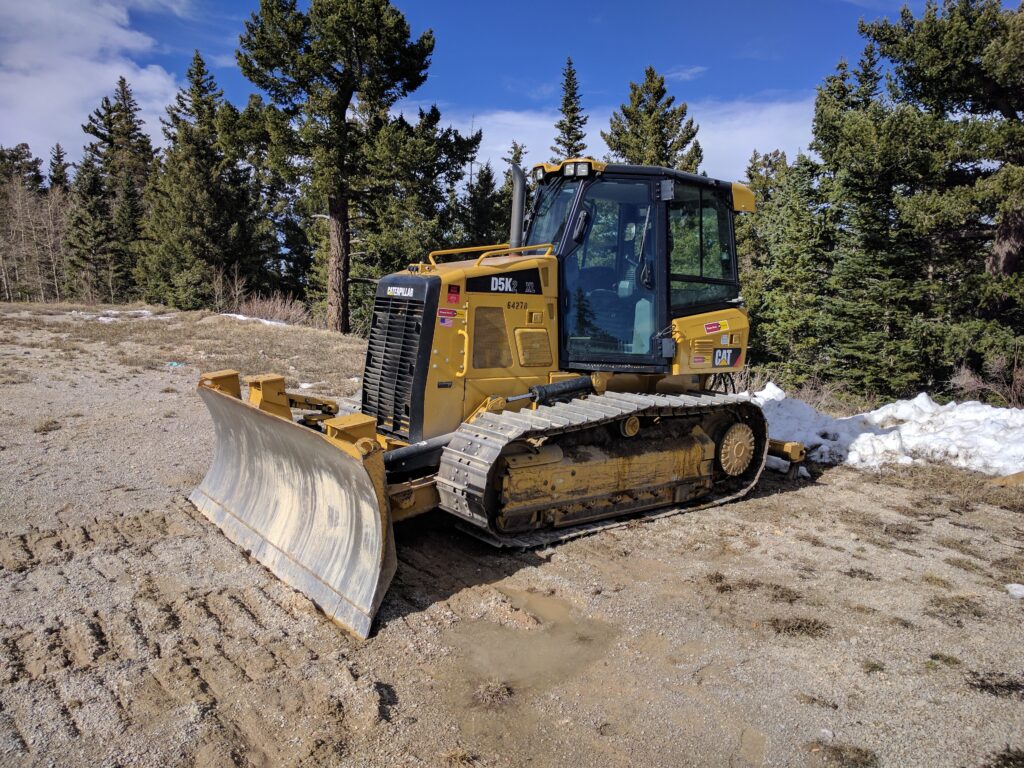Caterpillar D5K2 crawler dozer with 6-way blade