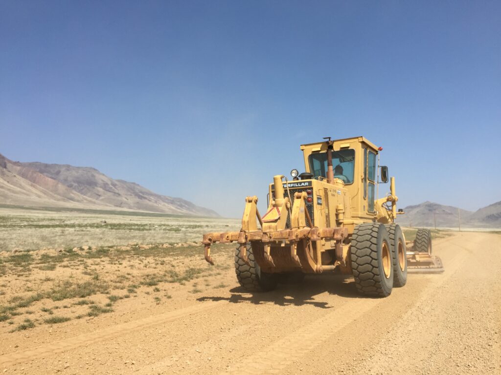 Motor grader working a gravel county road